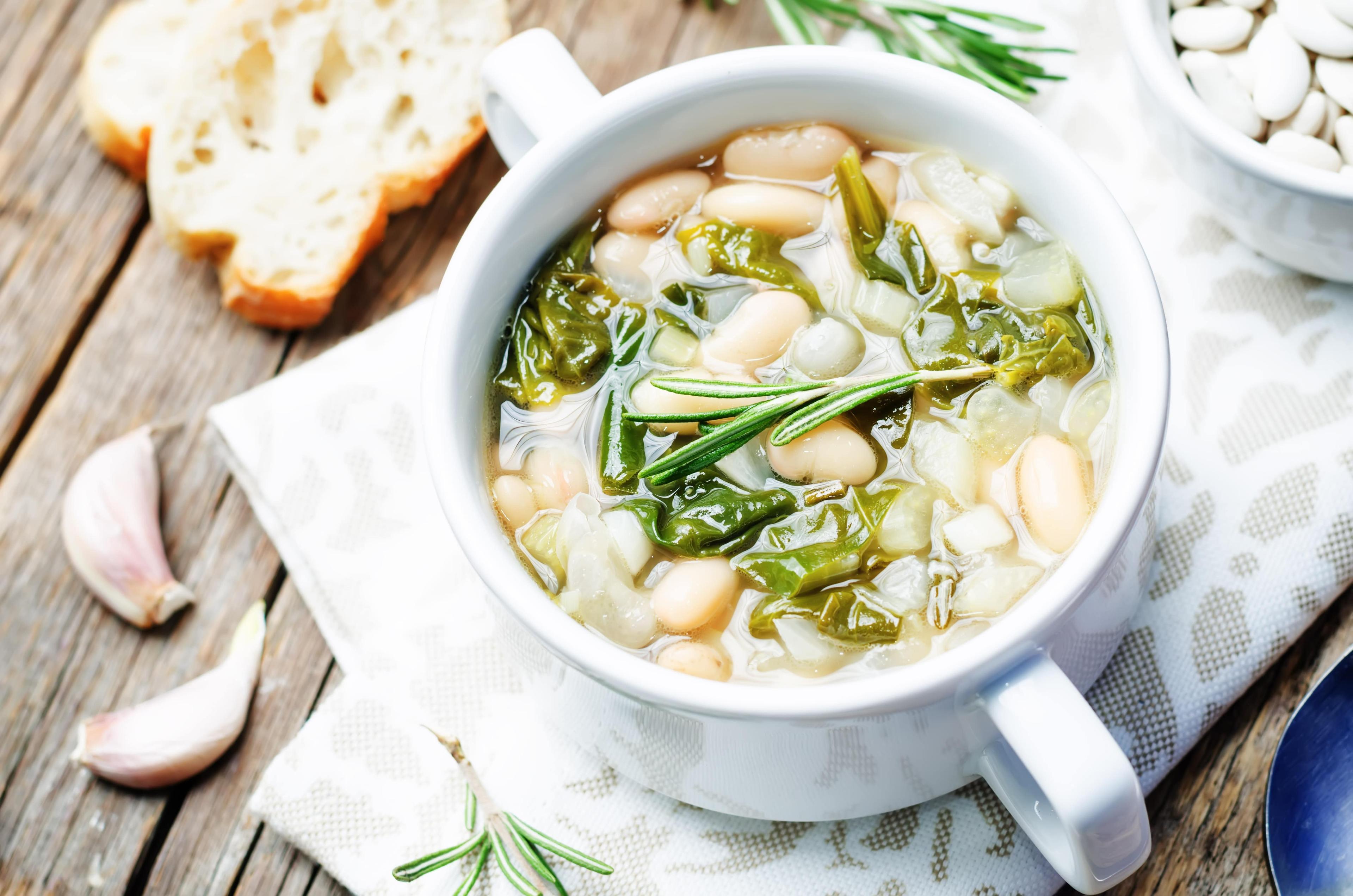 A plate of escarole soup, also known as Wedding soup.